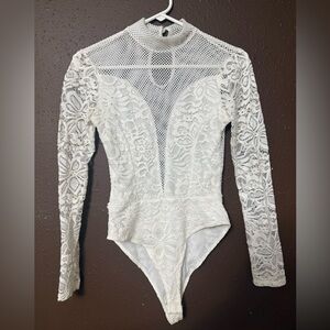 Woman’s Elegant White Long Sleeve Lace Bodysuit.